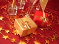 Golden and red gift boxes, stars on beautiful background with ch Royalty Free Stock Photo