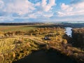 Golden red sunlight AERIAL view, Russia, River, small town, bridge Royalty Free Stock Photo