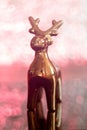 Golden reindeer Christmas decoration on top of a table Royalty Free Stock Photo