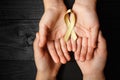 Golden ribbon childhood symbol of the fight against cancer