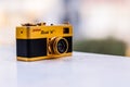 Golden Ricoh 16 Mini Film Camera Soft Focus Background