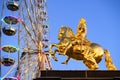 The Golden Rider or Goldener Reiter, the statue of August the Strong, near Ferris wheel. Saxony, Germany. November 2019