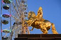 The Golden Rider or Goldener Reiter, the statue of August the Strong, near Ferris wheel. Saxony, Germany. November 2019