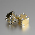 Golden right handed casino dice with silver eyes