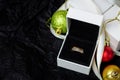 Golden ring with dimonds in white gift box