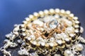 Golden ring with gem on pearl necklace Royalty Free Stock Photo