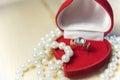 Golden ring with gem and pearls in a red gift box Royalty Free Stock Photo