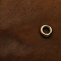 Golden ring over leather texture background, brown leather material pattern close view square illustration Royalty Free Stock Photo