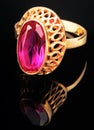 Golden ring with pink gem Royalty Free Stock Photo