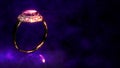 golden ring with pink gem stone on dark purple background with free space, not real design - abstract 3D rendering Royalty Free Stock Photo