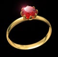 Golden ring with ruby gem isolated on black Royalty Free Stock Photo