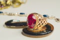 Golden ring with the ruby. jewelry background Royalty Free Stock Photo