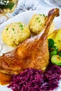 Golden roasted turkey leg with dumplings