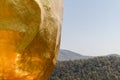 Golden rock stone detail, gold texture with mountain background