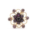 Golden round brooch with purple diamonds isolated on white