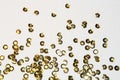 Golden round sequins sewing on white background