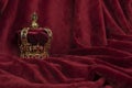 Royal crown on a red velvet background Royalty Free Stock Photo