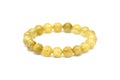Golden rutilated quartz bracelet on white background. Royalty Free Stock Photo