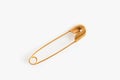 Golden safety pin on white background, top view Royalty Free Stock Photo