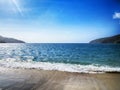 Golden sand beach under blue sky