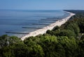 Golden sand beach with wooden breakwaters in Trzesacz, Baltic sea, Poland. Royalty Free Stock Photo