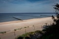 Golden sand beach with wooden breakwaters in Trzesacz, Baltic sea, Poland. Royalty Free Stock Photo