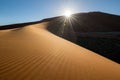 A golden sand dune was photographed at sunset Royalty Free Stock Photo