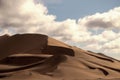 Golden sand dune 7 and white clouds on a sunny day in the desert Royalty Free Stock Photo