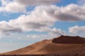 Golden sand dune 7 and white clouds on a sunny day in the Namib desert Royalty Free Stock Photo