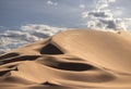 Golden sand dune 7 and white clouds on a sunny day in the Namib desert Royalty Free Stock Photo