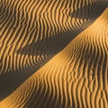 Golden sand forms gently undulating ripples, Royalty Free Stock Photo