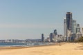 Golden sand of the Main Beach on the Gold Coast with the Surfers Paradise tourism destination city skyline in the distance, view Royalty Free Stock Photo