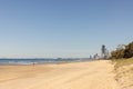 Golden sand of the Main Beach on the Gold Coast with the Surfers Paradise tourism destination city skyline in the distance, view Royalty Free Stock Photo