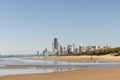 Golden sand of the Main Beach on the Gold Coast with the Surfers Paradise tourism destination city skyline in the distance, view Royalty Free Stock Photo