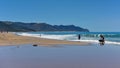 Golden sand Ocean Beach popular for recreational activities, New Zealand