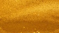 Golden sand texture background, top view of gold powder pile Royalty Free Stock Photo