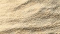 Golden sand texture with natural wave patterns Royalty Free Stock Photo