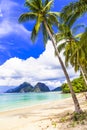 Golden sand,turquoise sea,palm trees and mountains,El nido,Palawan,Philippines. Royalty Free Stock Photo