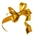 Golden satin gift bow. Ribbon. Isolated on white Royalty Free Stock Photo