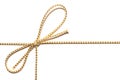 Golden satin rope with knotted bow gift ribbon wrap for Christmas present with intricate shine details isolated.