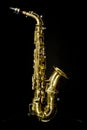 a golden saxophone with black background