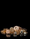 A golden scrap of old gold jewelry on black background Royalty Free Stock Photo