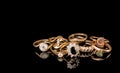 A golden scrap of old gold jewelry on black background Royalty Free Stock Photo