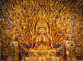 Golden sculpture of Avalokiteshvara Buddha or Guanyin with thousand hands at Dazu Rock Carvings at Mount Baoding or Baodingshan