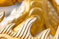 Golden sculpture close-up showing dragon spine. Royalty Free Stock Photo