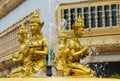 Golden sculpture man figures in fountain