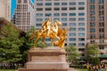 Golden sculpture of a man on horse in Manhattan