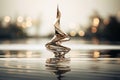 a golden sculpture sitting on top of a body of water