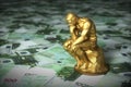 Golden Sculpture Of A Thinker Who Thinks Over Euro Banknotes