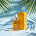 Golden serum bottle and yellow box with palm leaf shadows on blue vactor background Royalty Free Stock Photo